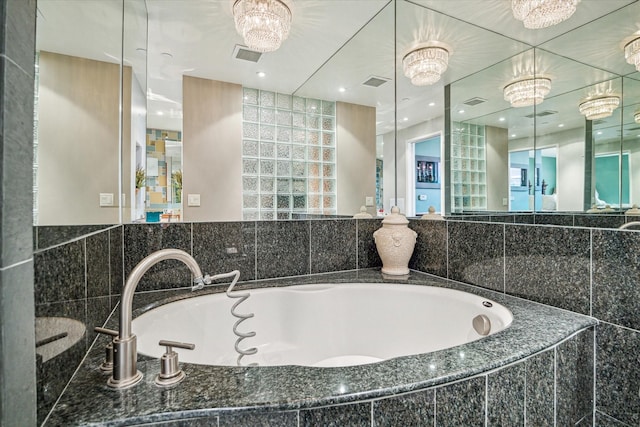 bathroom featuring tiled bath