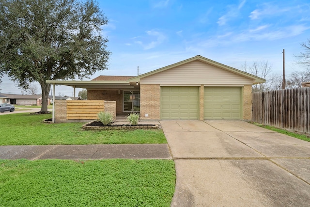 ranch-style home with a garage and a front yard