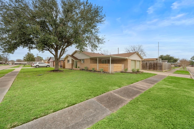 ranch-style home featuring a garage and a front lawn