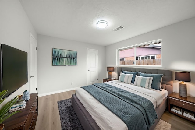 bedroom featuring wood-type flooring