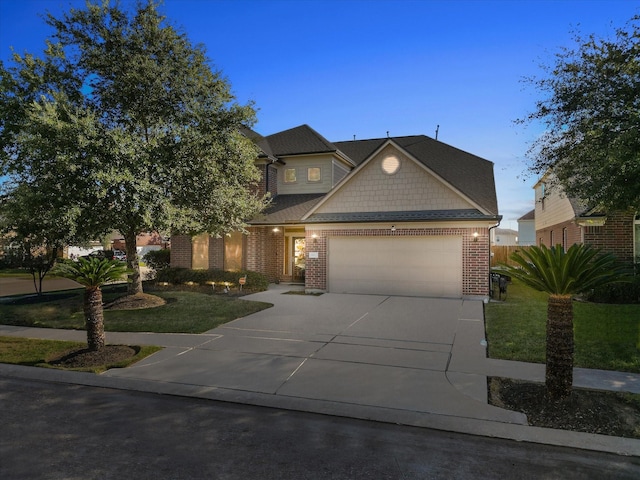 view of front of property featuring an attached garage, brick siding, concrete driveway, and a front yard
