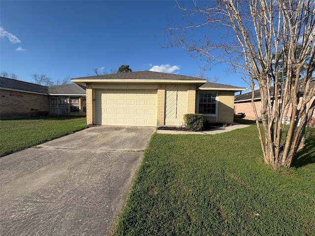 view of front of house with a garage and a front yard