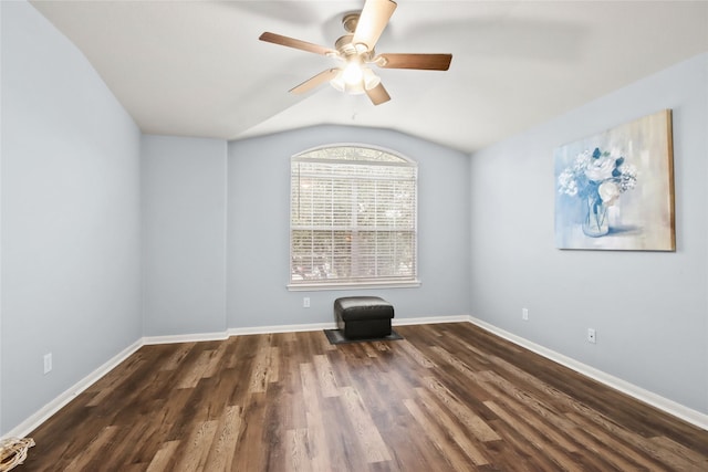 unfurnished room with vaulted ceiling, dark wood-type flooring, and ceiling fan