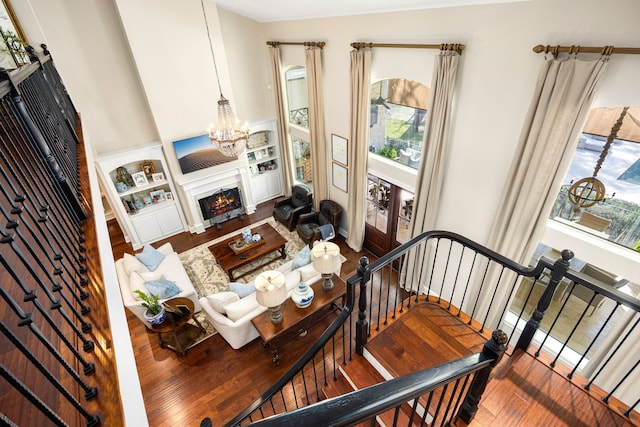 living room featuring hardwood / wood-style floors and an inviting chandelier