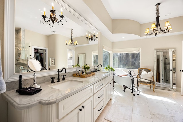 bathroom featuring vanity, a notable chandelier, and plus walk in shower