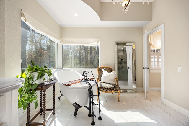 sitting room with an inviting chandelier