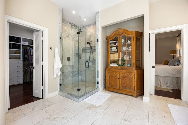 bathroom featuring an enclosed shower