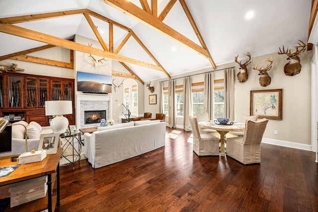 living room featuring high vaulted ceiling, dark hardwood / wood-style floors, and beamed ceiling