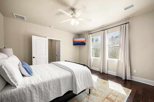 bedroom featuring ceiling fan and dark hardwood / wood-style floors