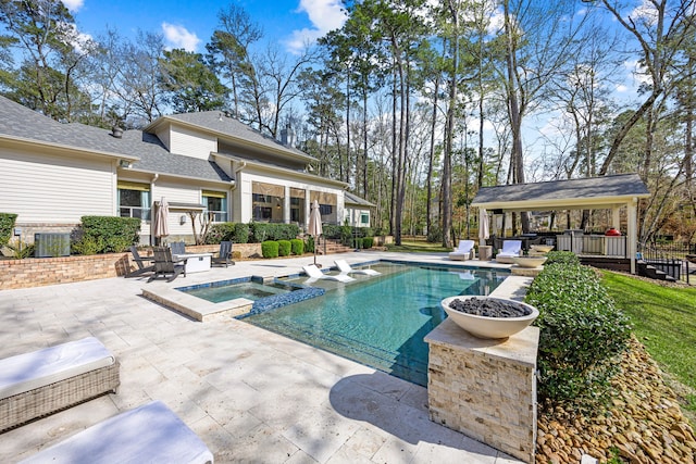 view of pool featuring a gazebo, cooling unit, an in ground hot tub, and a patio