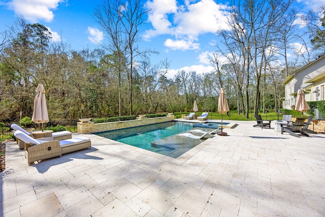 view of swimming pool featuring a patio