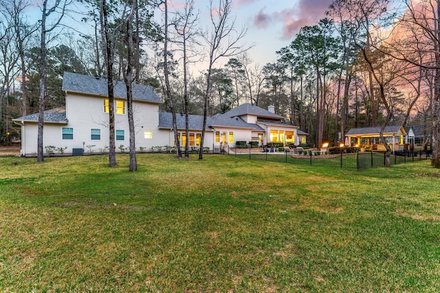 view of yard at dusk