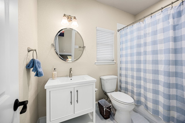 full bathroom featuring vanity, shower / tub combo, and toilet