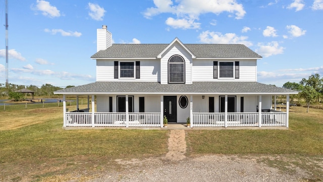 country-style home featuring a front lawn and a porch