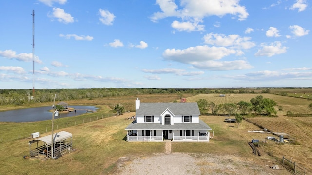 bird's eye view with a water view and a rural view