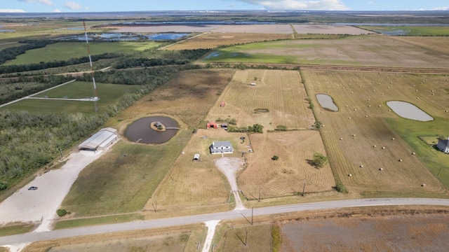 bird's eye view featuring a water view and a rural view