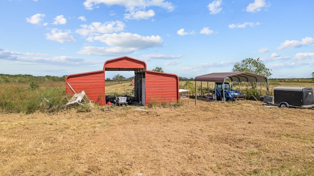 view of outbuilding with a carport