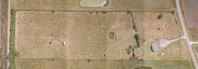 birds eye view of property featuring a rural view