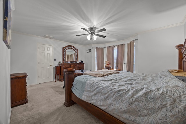 carpeted bedroom with crown molding and ceiling fan