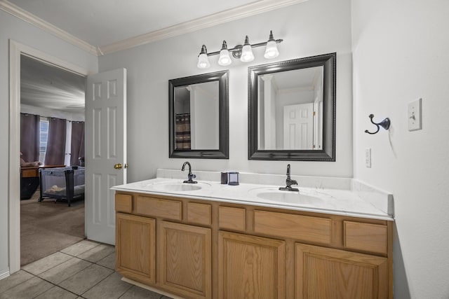 bathroom with tile patterned flooring, ornamental molding, and vanity