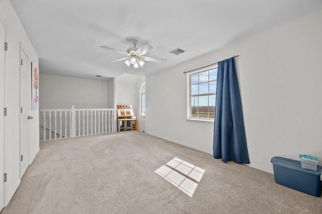 carpeted empty room with ceiling fan