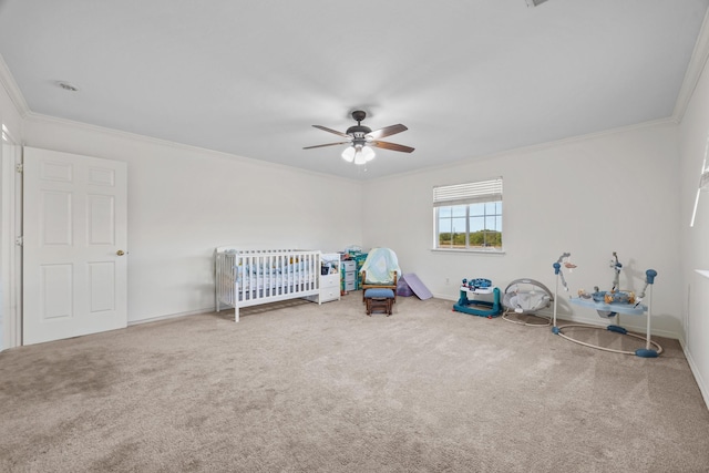 unfurnished bedroom with ornamental molding, ceiling fan, and carpet