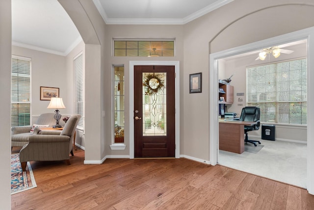 foyer entrance featuring hardwood / wood-style flooring and ornamental molding