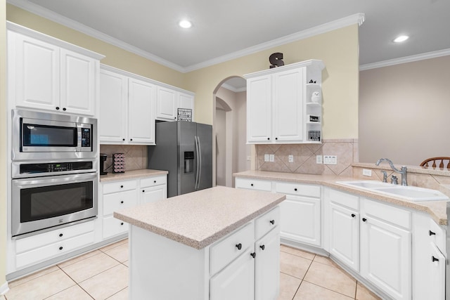 kitchen featuring white cabinetry, appliances with stainless steel finishes, and sink