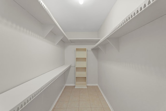 spacious closet with light tile patterned flooring