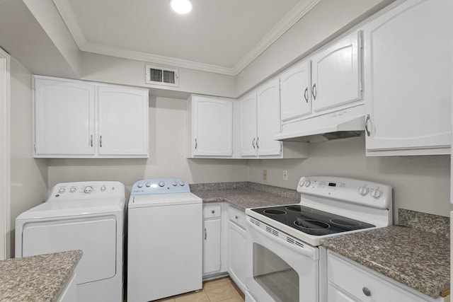 laundry room with ornamental molding, separate washer and dryer, and light tile patterned floors