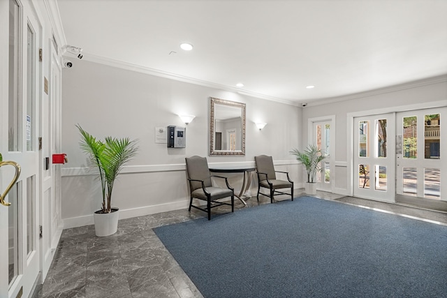 sitting room with ornamental molding