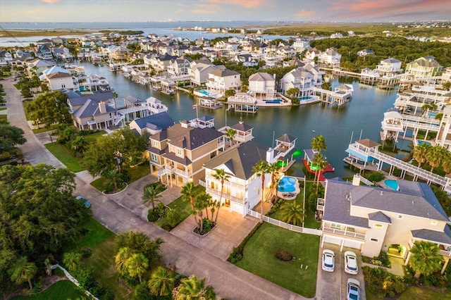 aerial view at dusk with a water view