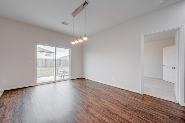 empty room featuring dark wood-type flooring