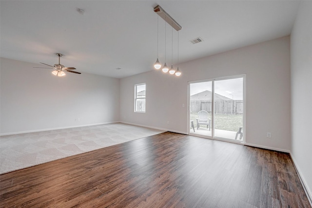 unfurnished room featuring hardwood / wood-style flooring and ceiling fan