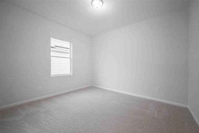 unfurnished room featuring carpet floors