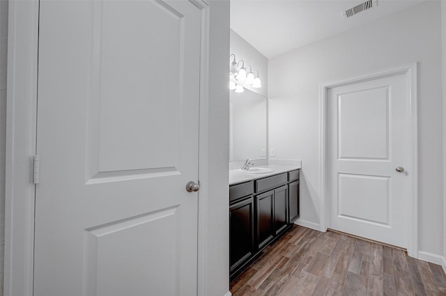 bathroom featuring vanity and wood-type flooring