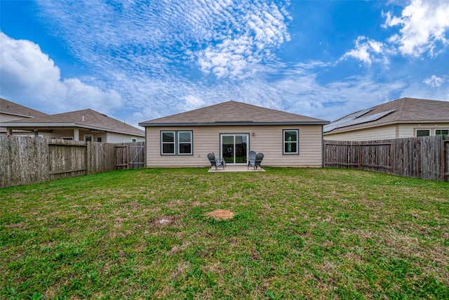 back of property featuring a yard and a patio area