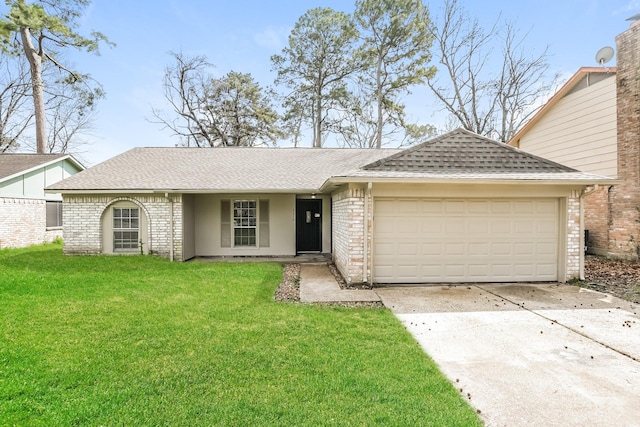 single story home featuring brick siding, an attached garage, concrete driveway, and a front yard