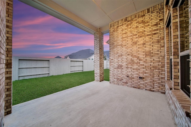 view of patio terrace at dusk