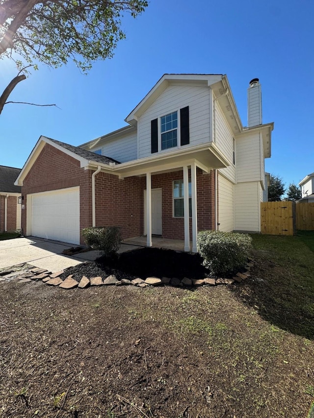 view of front of property featuring a garage and a porch