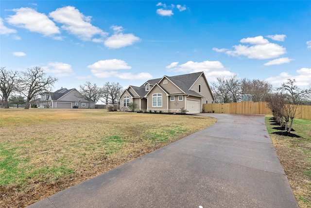 view of front facade with a garage and a front yard