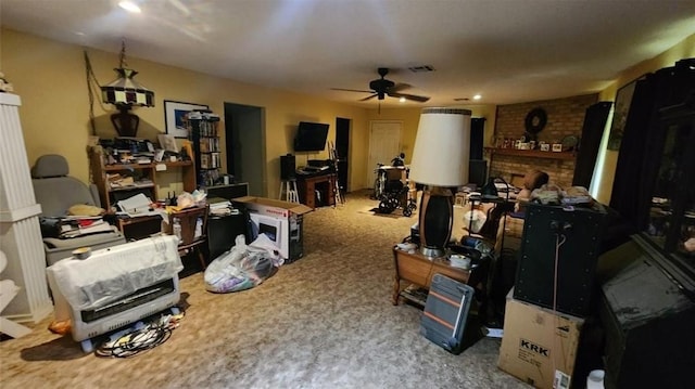 interior space featuring a ceiling fan, visible vents, and carpet floors