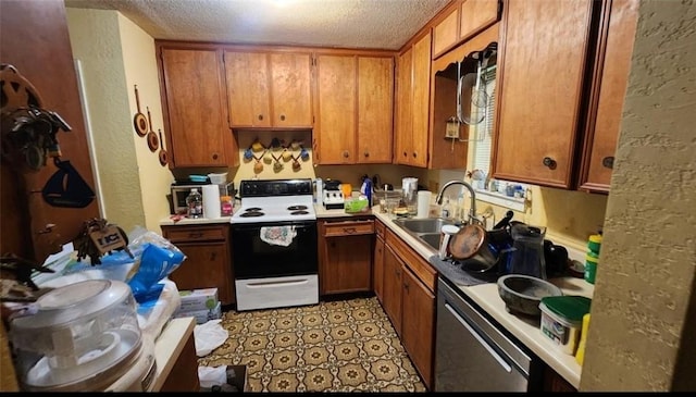 kitchen featuring a sink, brown cabinets, and electric range oven