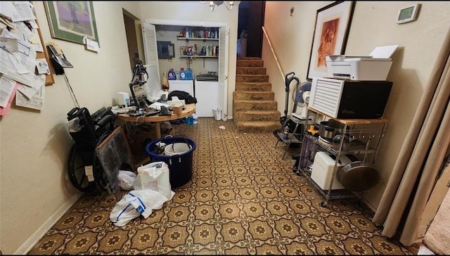 hallway featuring stairway and washer and clothes dryer