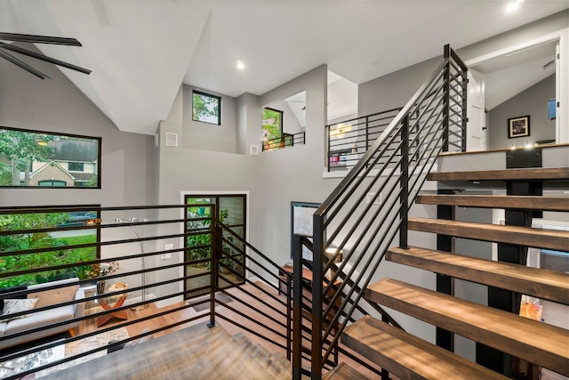 stairway with vaulted ceiling