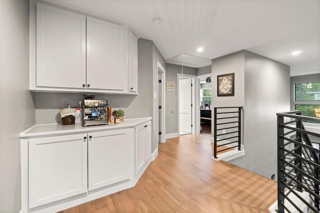 corridor with light hardwood / wood-style flooring