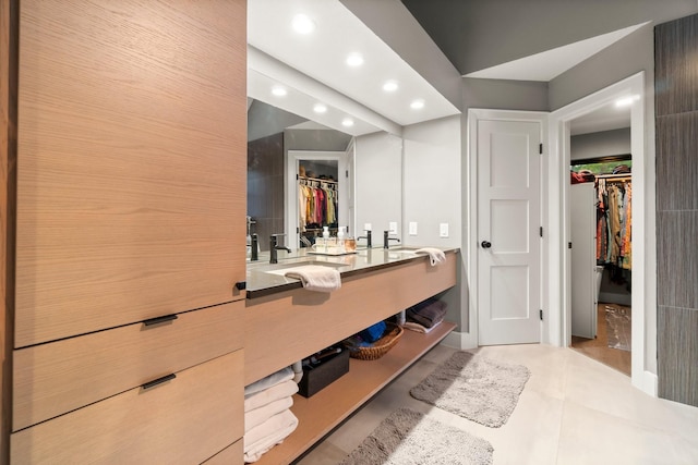 bathroom featuring tile patterned flooring and vanity