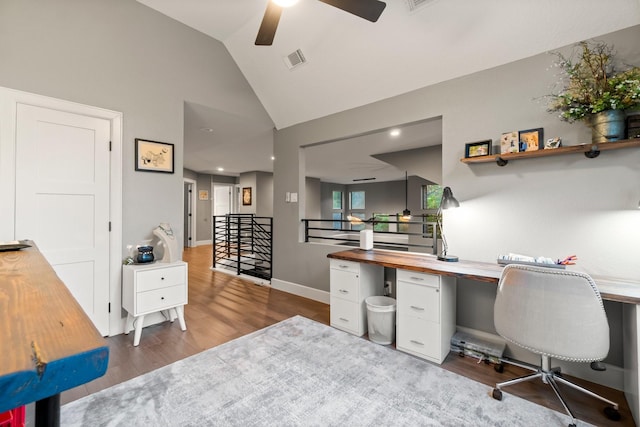 home office with lofted ceiling, dark wood-type flooring, and ceiling fan