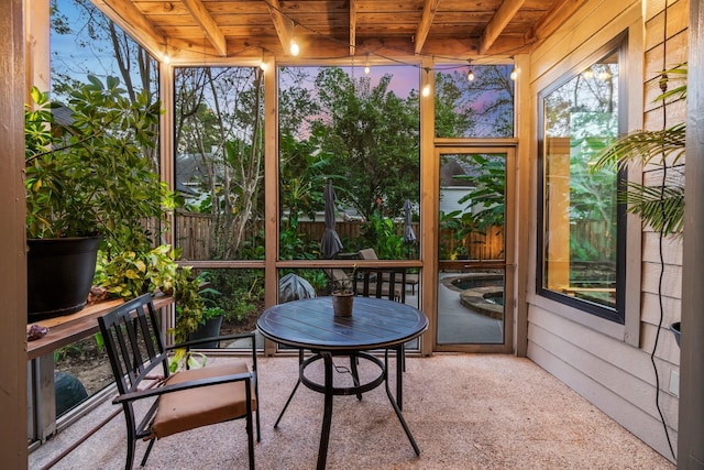 sunroom / solarium featuring wood ceiling