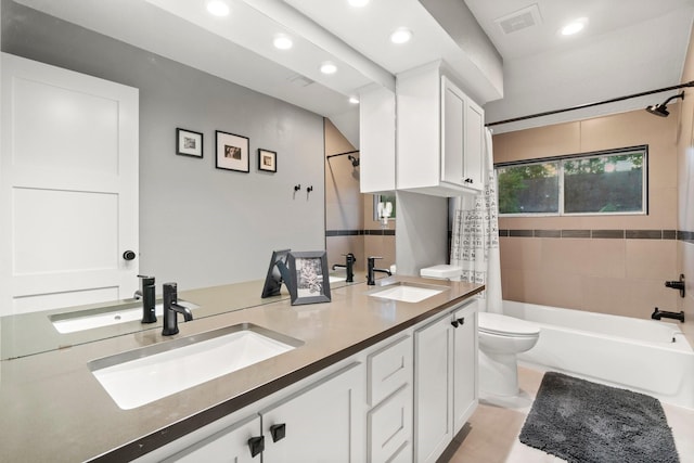 full bathroom with vanity, shower / bath combination with curtain, and toilet